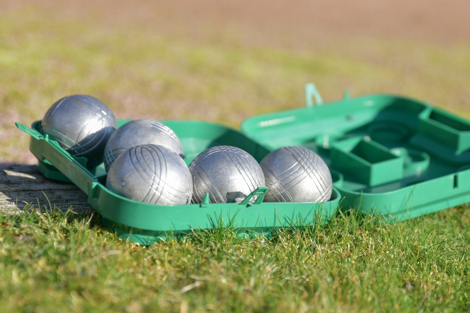 Petanque balls in a box on the grass